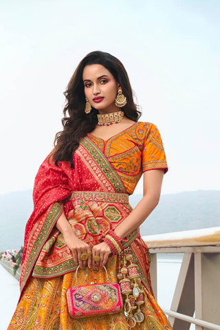 Radiant Yellow and Orange Banarasi Silk Festive Lehenga with Zarkan Detailing